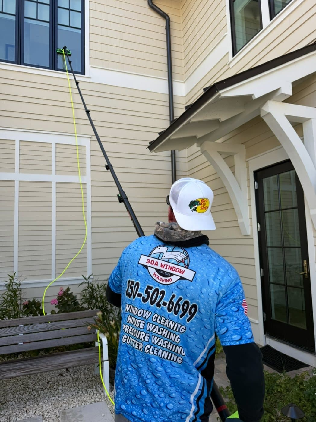 Reaching upper-story windows with an extension pole